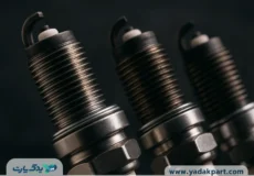 تصویر نزدیک از شمع خودرو با جزئیات رزوه و الکترود، مناسب برای مقاله‌های فنی درباره شمع ماشین خراب
